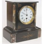 A late Victorian black slate and grey marble cased mantel clock, having a circular enamelled dial