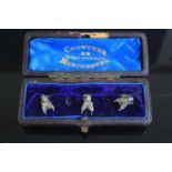 A set of three early 20th century white metal collar studs, each in the form of an insect, in