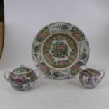 A Chinese Canton plate, enamel decorated with birds amongst flowers, together with similar milk