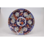 A Japanese late Meiji period charger, decorated in the Imari palette in shades of iron-red and