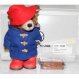 A Steiff model of Paddington Bear No. 228 in chestnut mohair with suitcase, boxed with