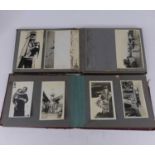 An early 20th century photograph album containing views from Asia and Africa, together with