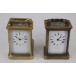 An early 20th century lacquered brass cased carriage clock having a white enamel dial with Roman