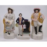 A pair of Victorian Staffordshire flat back figures, the fish seller and his wife, each in
