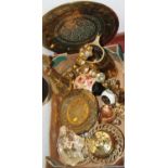 A box of principally brassware to include Eastern chargers, pedestal vase, trivet stands, and some