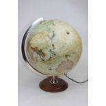 A contemporary table lamp in the form of a terrestrial globe, height 38cm