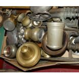 A collection of metalware to include pewter chargers, copper measures and cast brass door pulls