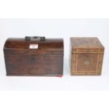 An early 19th century walnut tea caddy of cubic form, having geometric boxwood and pear wood