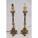 A pair of ecclesiastical style brass table lamps, height 47cm (including fittings)