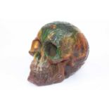 A coloured resin model of a human skull, height 13cm
