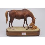 A Royal Worcester figure of a horse and foal entitled The Newborn, modelled by Doris Lindner,
