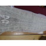 An early 20th century silk and lace train for a wedding dressA small tear and another similar