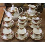 A Royal Albert eight-place setting tea service in the Old Country Roses patternTeapot is cracked.The