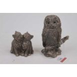A modern filled silver model of an owl perched on a branch, with glass eyes, h.11cm; together with a