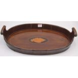A 19th century walnut twin handled serving tray, of brass coopered oval form, the centre inlaid with