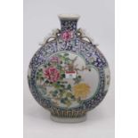 A Chinese export moon flask enamel decorated with birds and flowers within a further famille rose