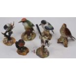 A Royal Crown Derby figure of a long tailed tit, height 15cm, together with four others, to