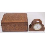 An Edwardian mahogany and chequer strung cased mantel clock, having a convex enamelled dial with