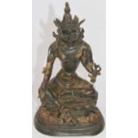 A bronzed figure of a deity, seated on a pedestal, height 26cmOf recent manufacture.Appears free