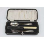 A George VI three-piece christening set, to include a silver fork and spoon, with matching steel-