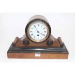 A Victorian and walnut ebonised drum top mantel clock having a circular enamel dial with Roman