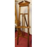 A walnut freestanding artist's easel, with adjustable ledgeOverall in very good condition with a few