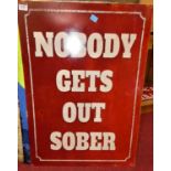 A contemporary printed metal wall sign titled 'Nobody Gets Out Sober; 70 x 50cm