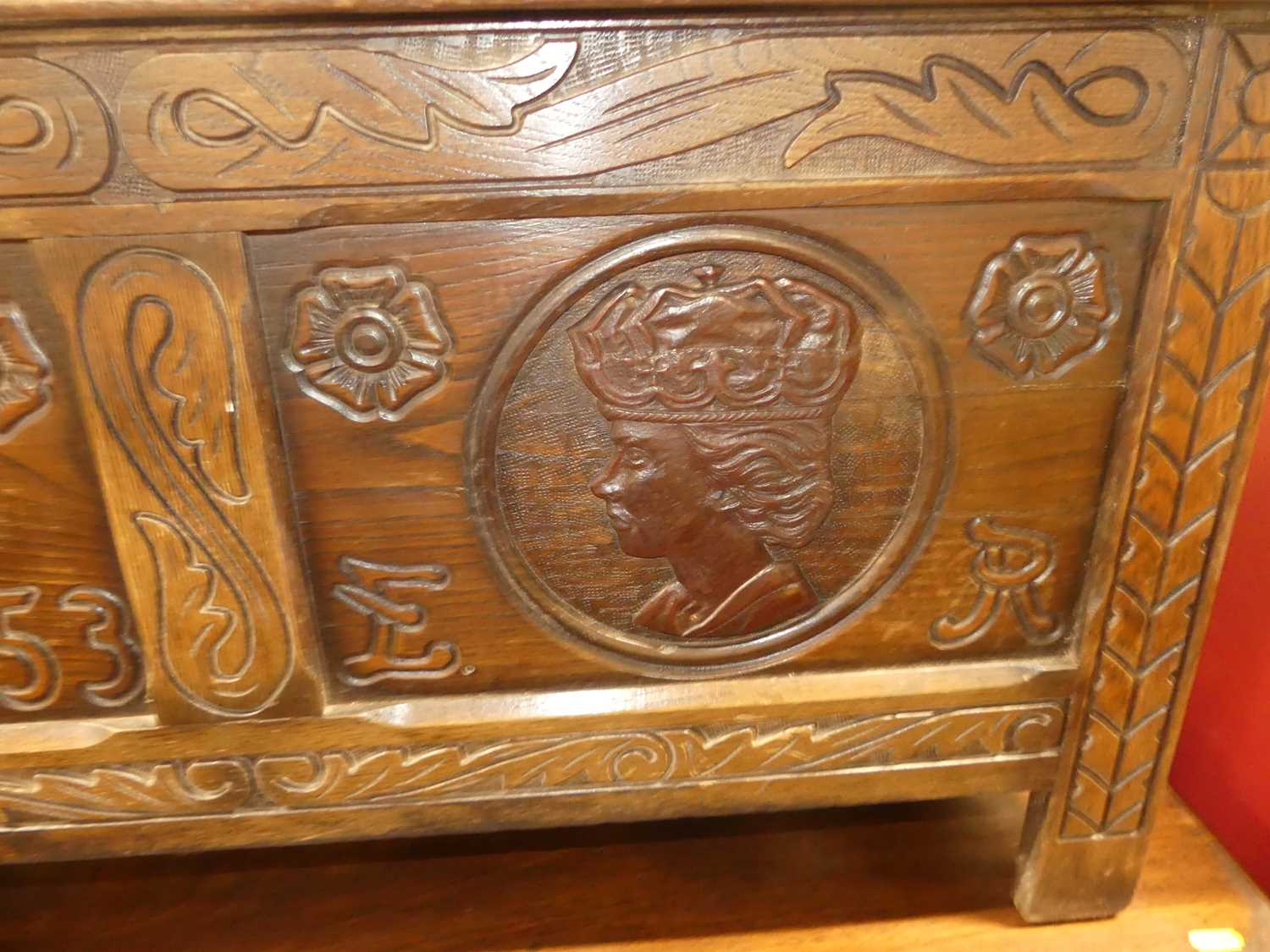 A mid-20th century line carved oak twin panelled blanket chest, each panel with Monarchs portrait - Image 9 of 10