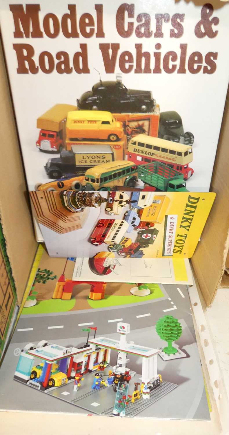 A box of model collecting hardback books and brochures, to include a Lego City poster, Dinky Toys by