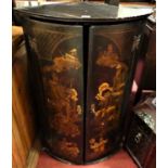 A circa 1800 chinoiserie lacquered bowfront double door hanging corner cupboard