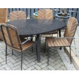 A contemporary black painted hardwood and wrought metal patio suite comprising; leaf shaped table