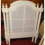 A pair of contemporary white painted French style single headboards, each with split can central