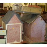 A collection of four mid 20th century dolls houses