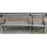 A black painted wrought iron ended and pine slatted two-seater garden bench, width 120cm, together