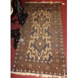 A Persian woollen small Shiraz rug, having a slightly faded ground, 164 x 93cm
