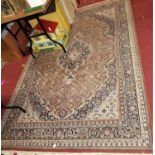 A Persian woollen multi-colour ground Tabriz rug, with lobed floral central lozenge within