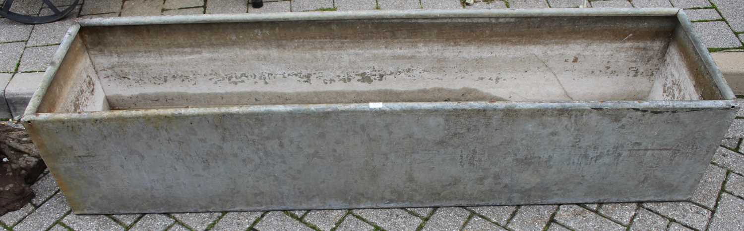 A galvanised metal agricultural rectangular livestock feeding trough, length 182.5cmAge related