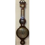 An early 19th century mahogany four-dial wheel barometer, the lower scale titled 'Warrented