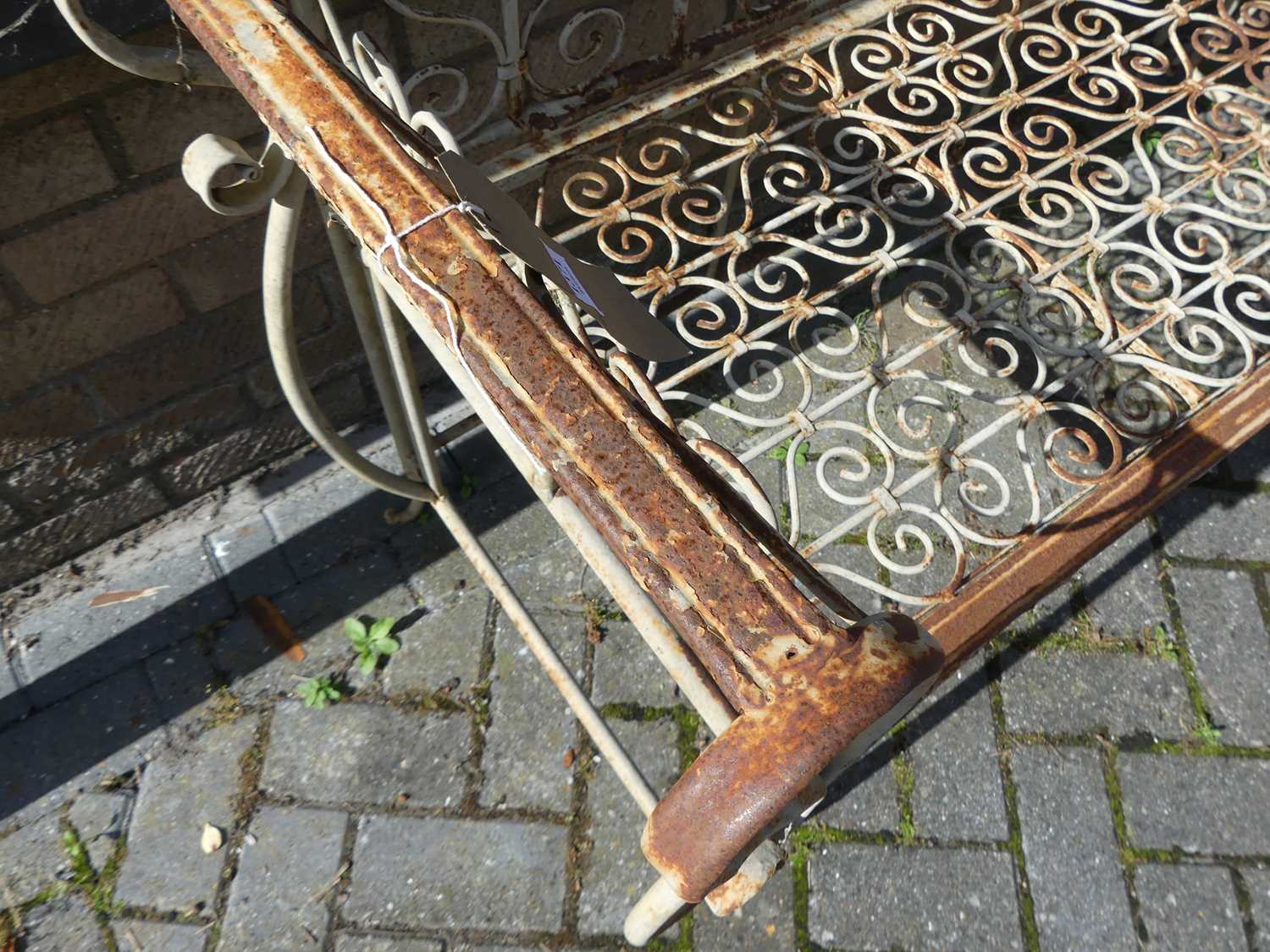 A wrought metal floral scroll decorated two-seater garden bench, width 129cmSolid and stable, but - Image 2 of 3