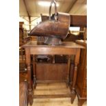 A 1920s oak rectangular side table, together with a Victorian copper helmet shaped coal scuttle (2)
