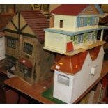 Three mid 20th century dolls houses to include Triang