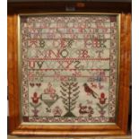 A Victorian children's alphabet, number and picture sampler, housed in a maple frame, 40 x