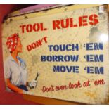 A contemporary printed metal wall sign titled 'Tool Rules, Don't Touch 'Em, Borrow 'Em, Move 'Em,