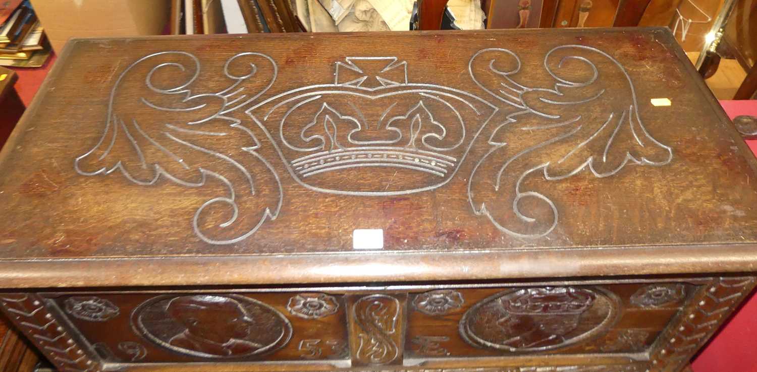 A mid-20th century line carved oak twin panelled blanket chest, each panel with Monarchs portrait - Image 2 of 10