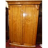A mid-Victorian satinwood double door wardrobe, the interior with hanging compartment, four linen