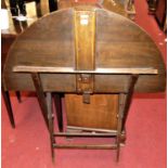 An early 20th century beech folding coaching table, with label for Thornton & Herne, 13 Little