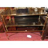 A pair of contemporary gilt brass and smoky glass inset two-tier rectangular coffee tables, length