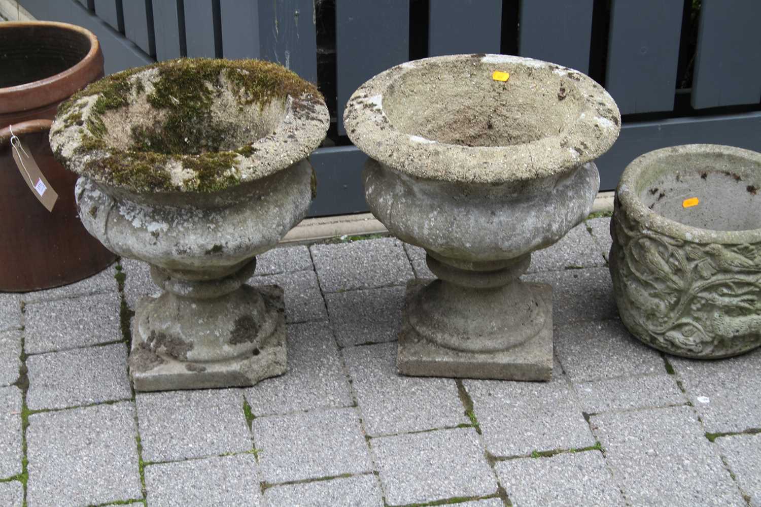 A pair of reconstituted stone footed garden urns, together with a further pair of reconstituted - Image 4 of 5