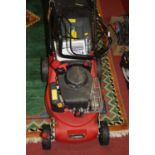 A Sovereign petrol-driven lawn mower, with grass collecting box