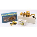 A collection of three various mixed construction vehicles to include a Bomag No. 1 1/50 scale